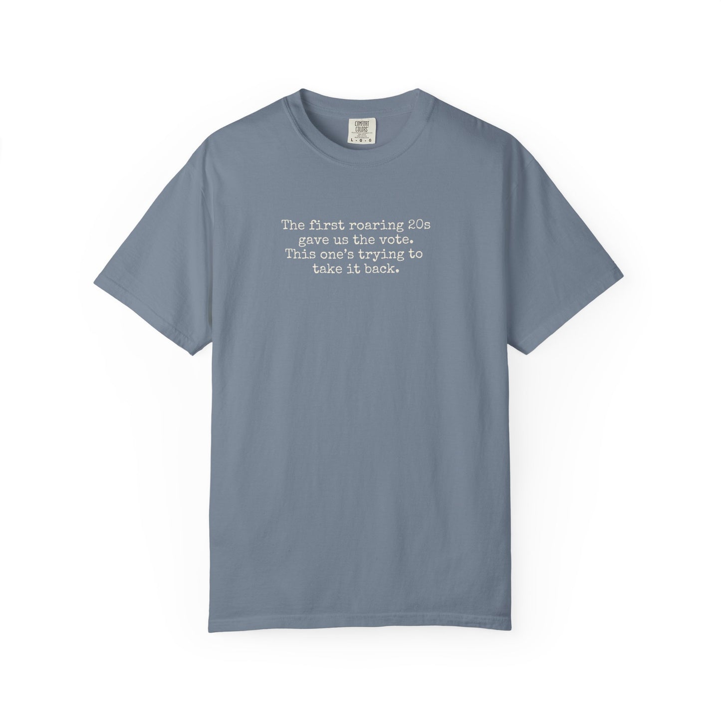 Blue unisex Comfort Colors t-shirt  with "the first roaring 20s gave us the vote. this one's trying to take it back" cream text.