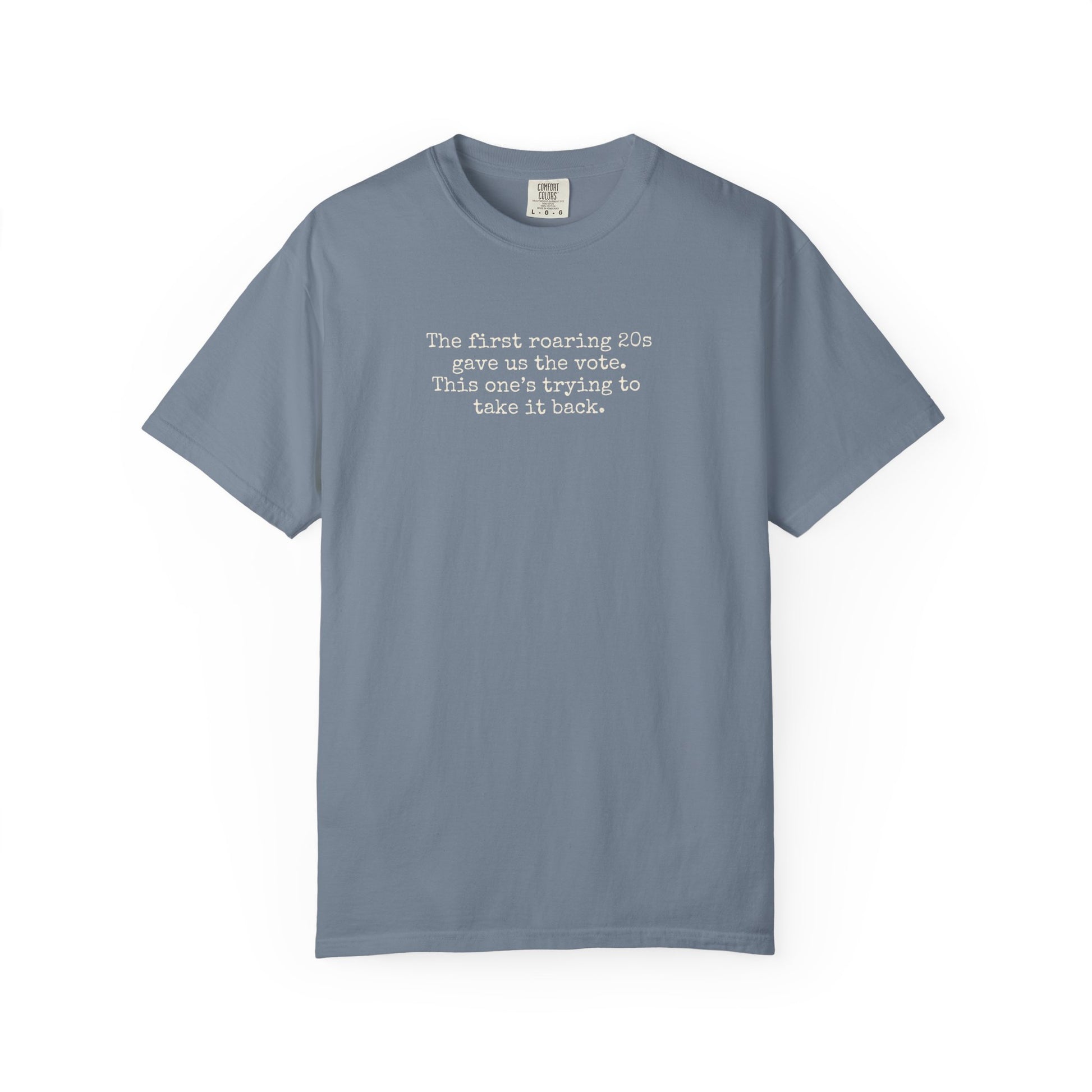 Blue unisex Comfort Colors t-shirt  with "the first roaring 20s gave us the vote. this one's trying to take it back" cream text.