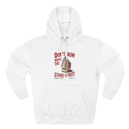 White hoodie with a retro iron graphic and "don't iron while the strike is hot" red text