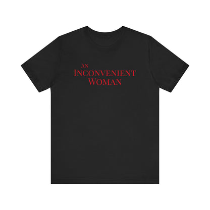Black t-shirt with red text "An Inconvenient Woman"