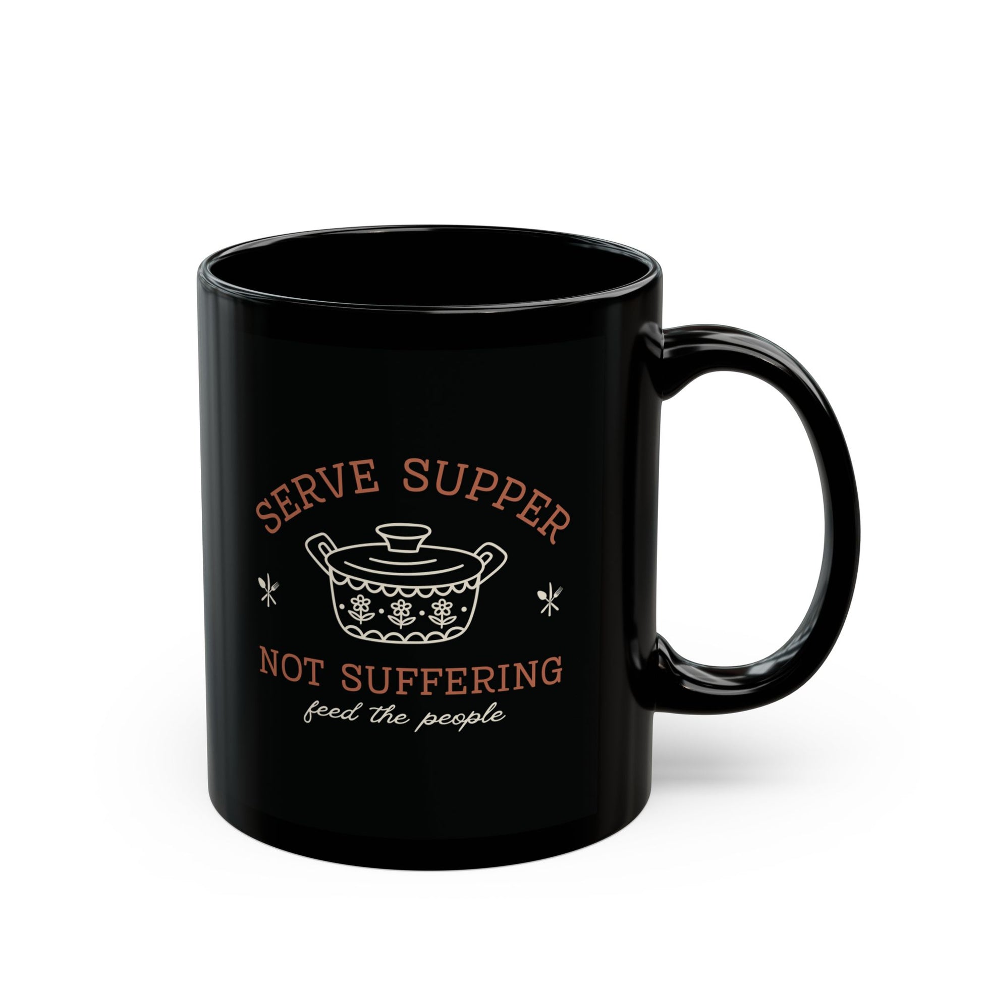Black 11 oz mug with white vintage pyrex illustrated graphic and dark orange and white text "serve supper, not suffering, feed the people"