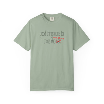 Green unisex t-shirt with "Good things come to those who wait (organize)" in black and red text