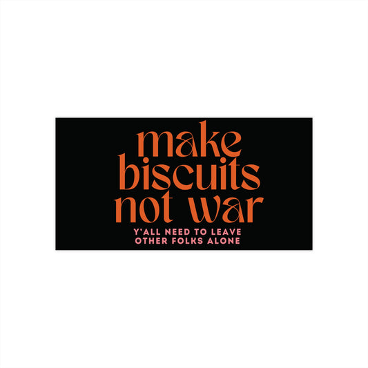 Black bumper sticker with orange text 'make biscuits not war' and smaller pink text 'y'all need to leave other folks alone' 