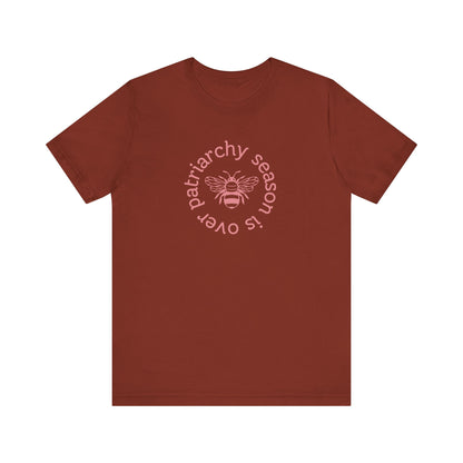 Rust unisex t-shirt with 'Patriarchy season is over' dark pink text and bee graphic