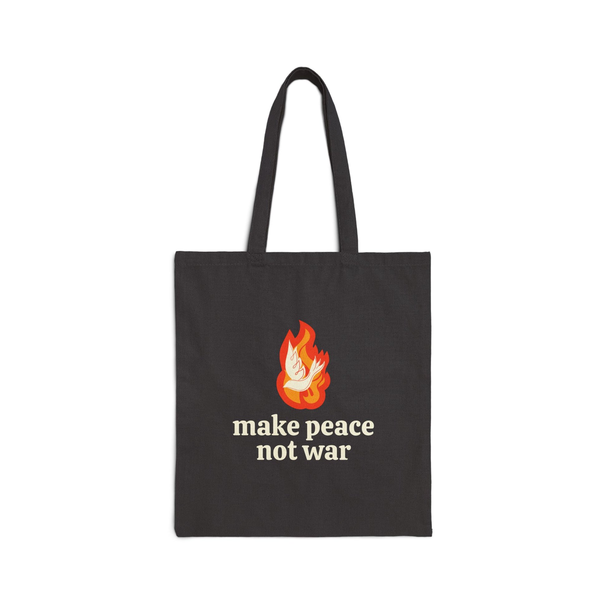 Black tote bag with a white dove and orange illustrated flame design and 'make peace not war' cream text 