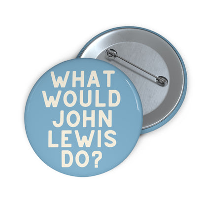 Light blue pin button with 'What Would John Lewis Do?' cream text