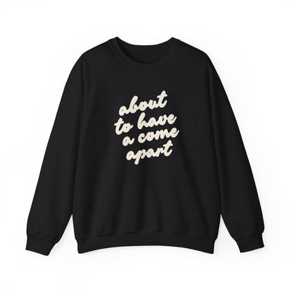 Black sweatshirt with "about to have a come apart" in cream text