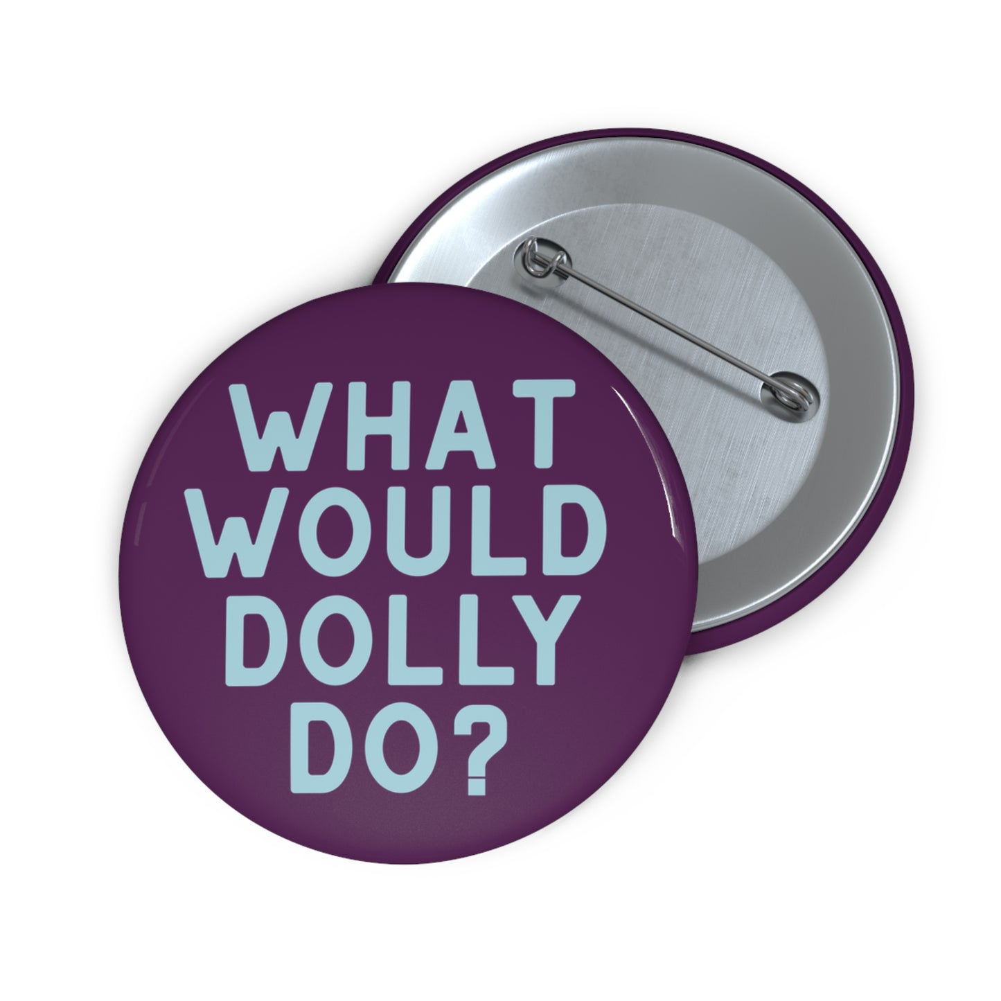 Two round pinback buttons on a white background. The front button is purple with the text 'WHAT WOULD DOLLY DO?' in light blue.