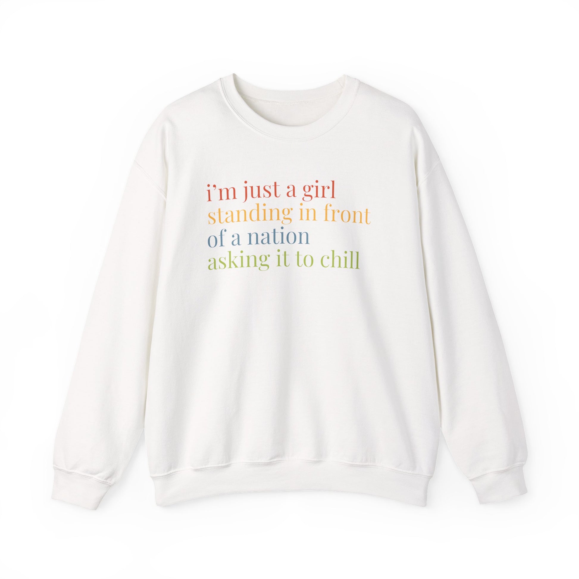 White Unisex crewneck sweatshirt with colorful “I'm just a girl, standing in front of a nation, asking it to chill” text
