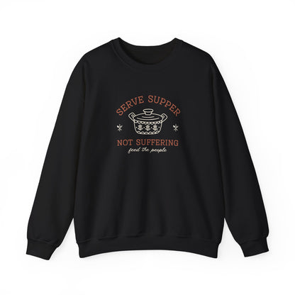 Black sweatshirt with a white vintage Pyrex illustration and dark orange and white text "serve supper, not suffering, feed the people"