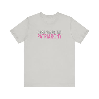 Light gray t-shirt with black and hot pink text 'Grab em by the Patriarchy' 