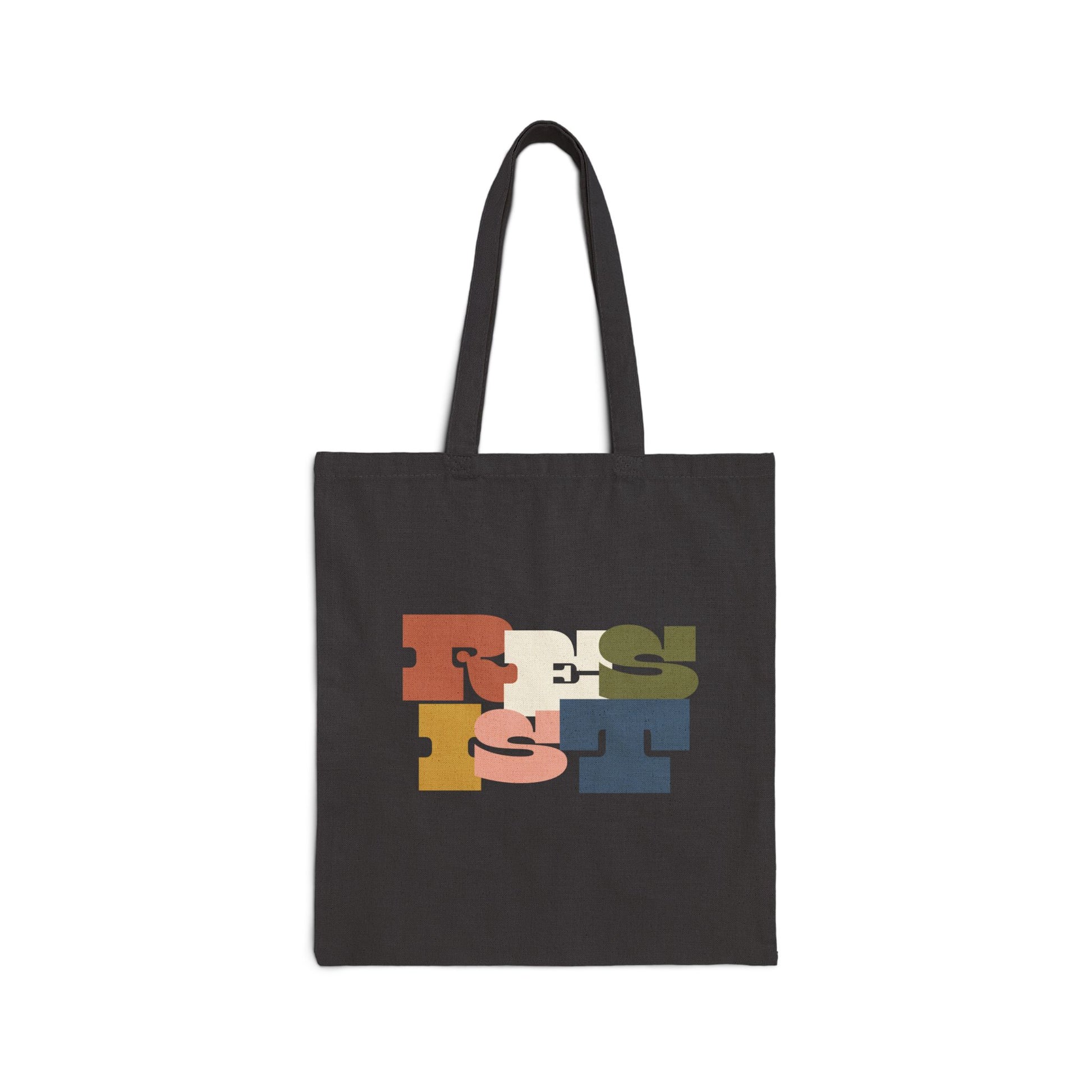 Black tote bag with colorful letters "RESIST"