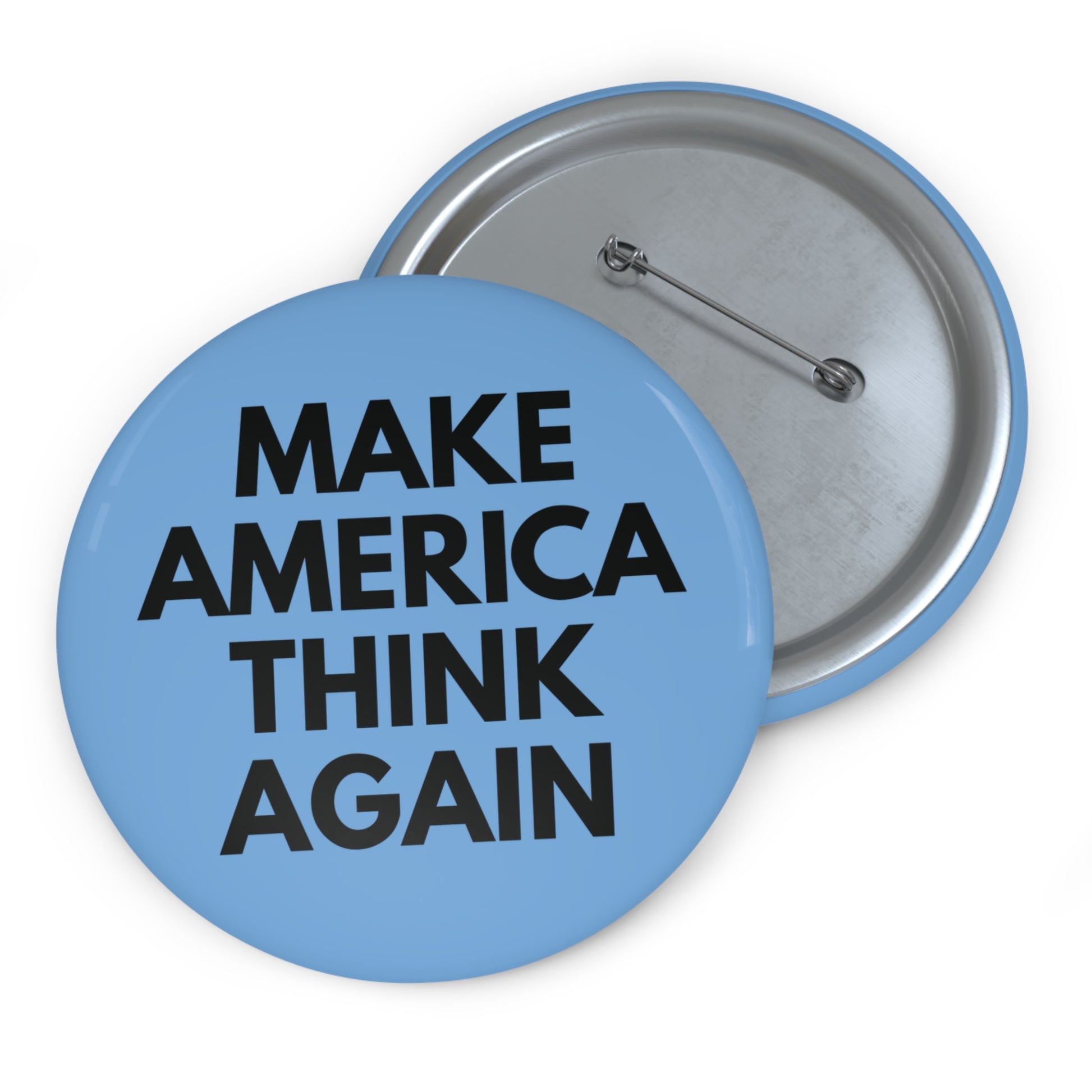 Light blue pin button with 'MAKE AMERICA THINK AGAIN' black text