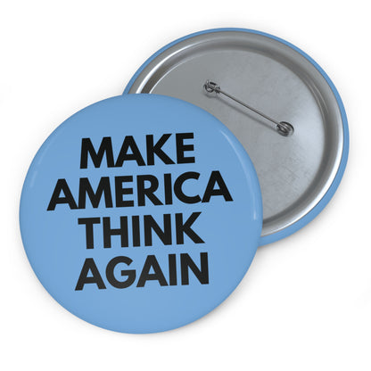 Light blue pin button with 'MAKE AMERICA THINK AGAIN' black text