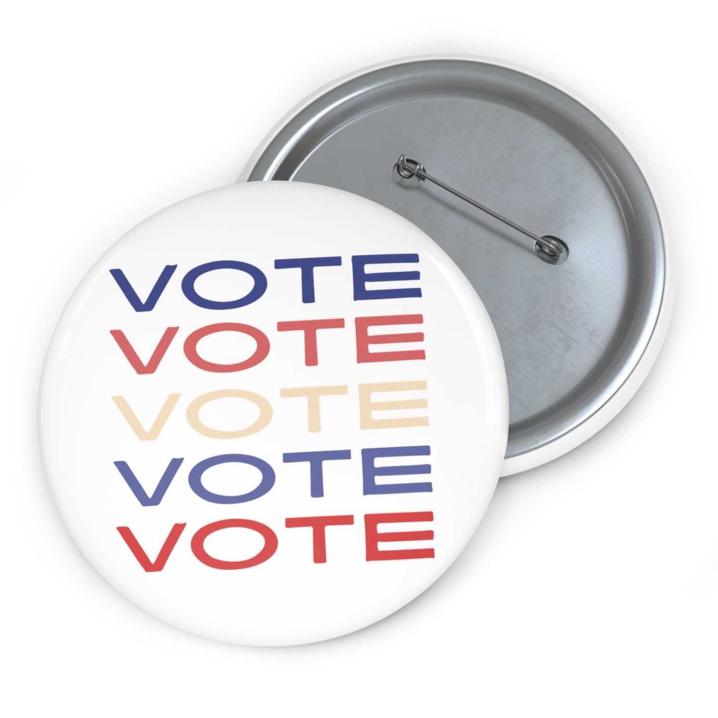 Two round pinback buttons on a white background, one showing the front with the word 'VOTE' repeated in blue, red, and cream, and the other showing the silver metal back with a safety pin.