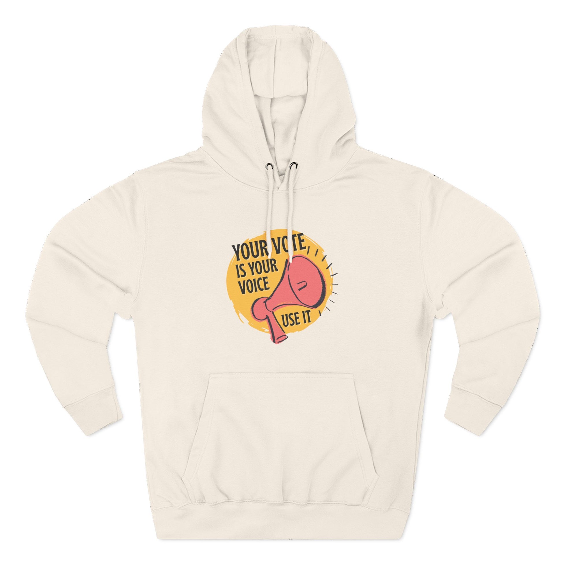 Beige hoodie with coral megaphone graphic against a bright yellow circle and black text "your vote is your voice, use it"