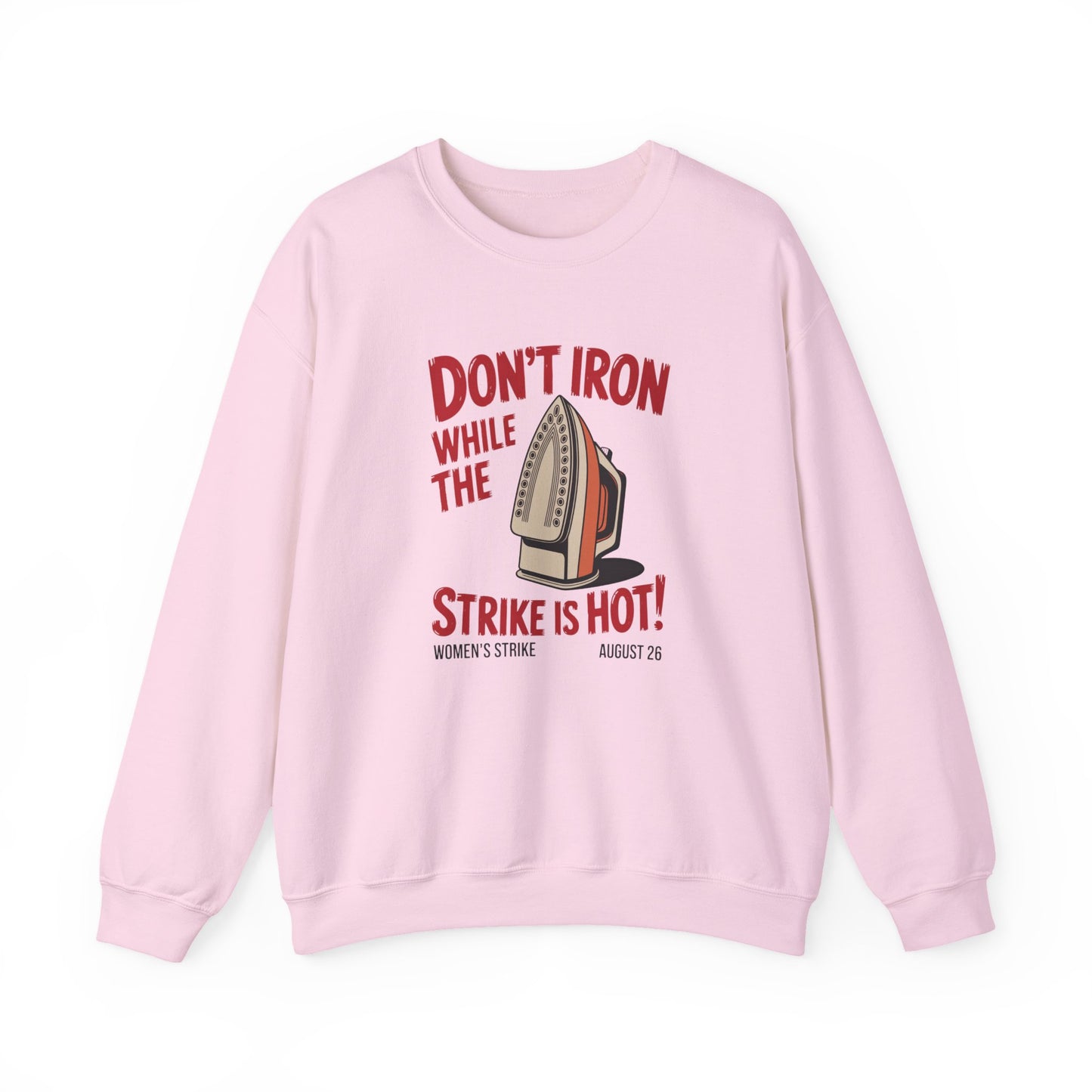 Light pink unisex crewneck sweatshirt with "don't iron while the strike is hot" red text and a vintage iron graphic
