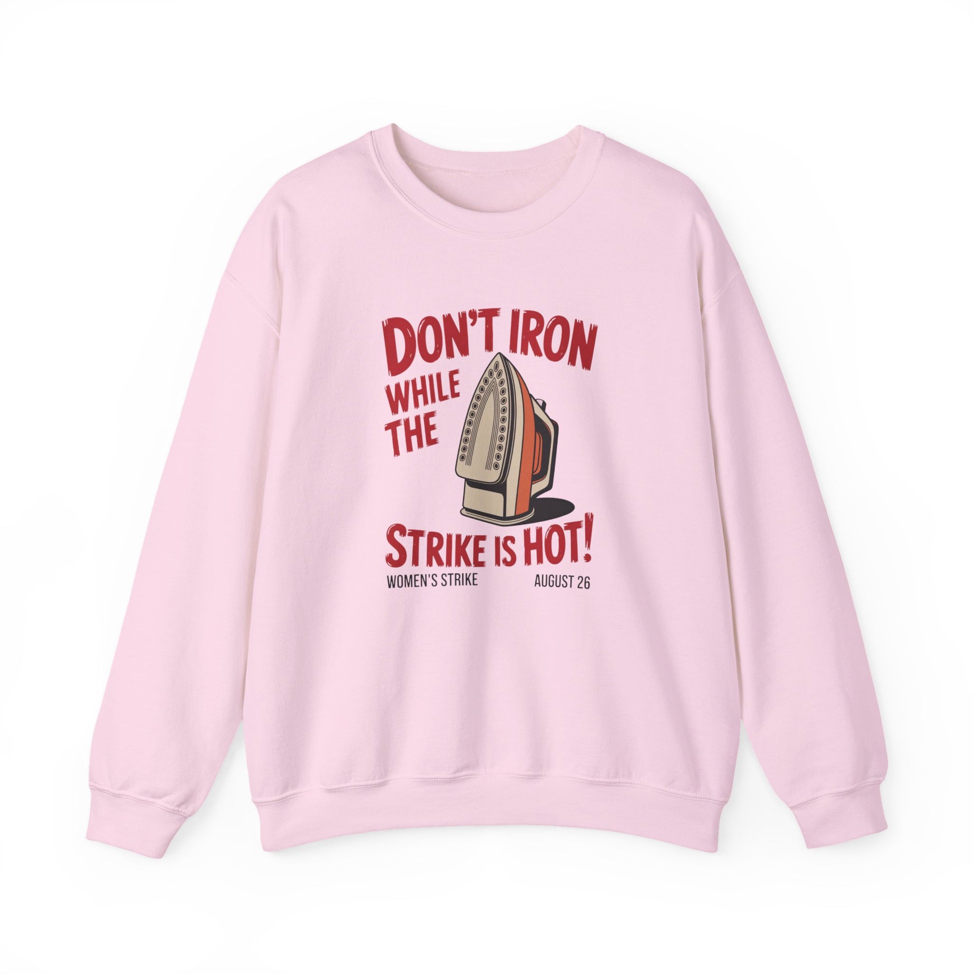 Light pink unisex crewneck sweatshirt with "don't iron while the strike is hot" red text and a vintage iron graphic