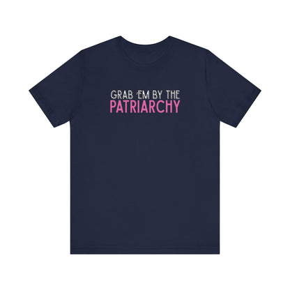 Navy blue t-shirt with black and hot pink text 'Grab em by the Patriarchy' 