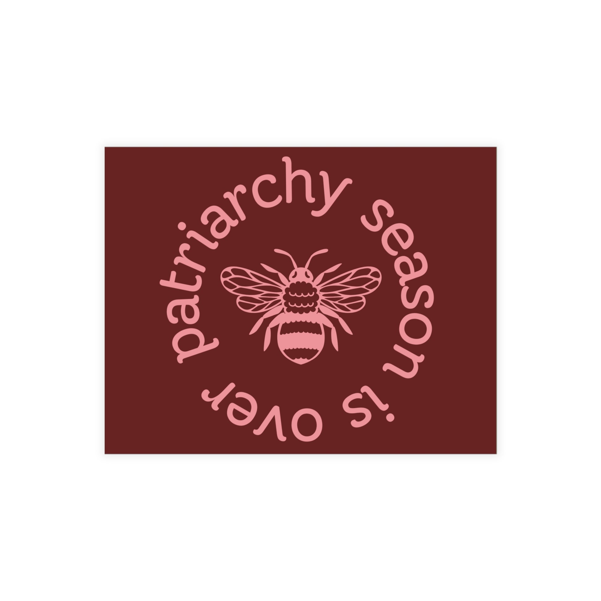 Maroon postcard with a pink queen bee illustration and pink text 'patriarchy season is over' 