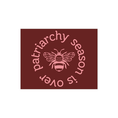 Maroon postcard with a pink queen bee illustration and pink text 'patriarchy season is over' 
