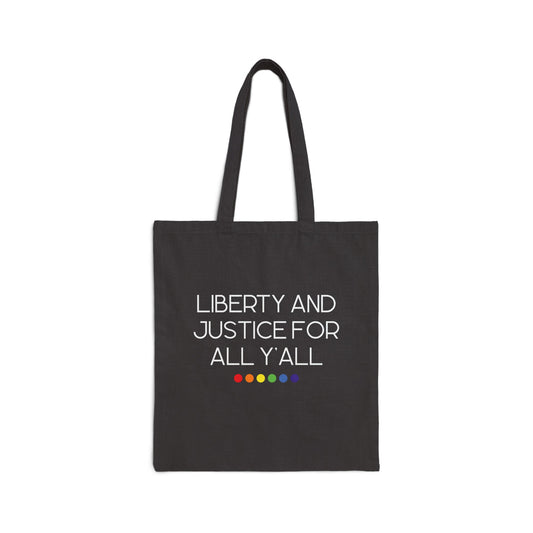 Black canvas tote bag with 'Liberty and Justice for All Y'all' white text and rainbow colored dots