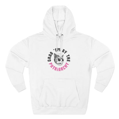 White hoodie with a punk rock cat graphic and text "grab 'em by the patriarchy" in black and pink
