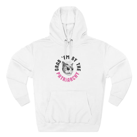 White hoodie with a punk rock cat graphic and text "grab 'em by the patriarchy" in black and pink