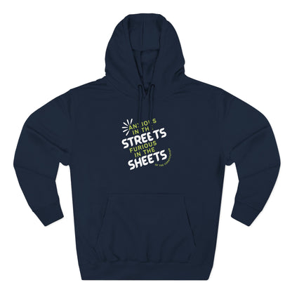 Navy blue hoodie with "anxious in the streets furious in the sheets of the constitution" green and white text