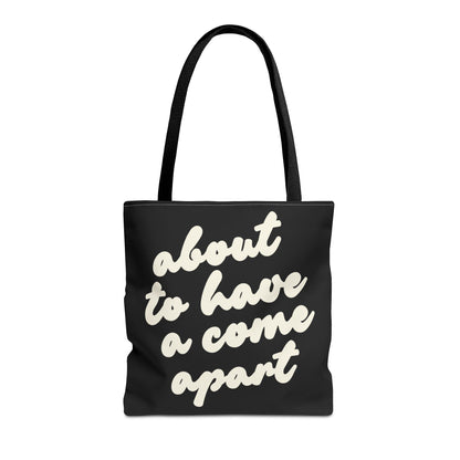 Black tote bag with "about to have a come apart" in cream text