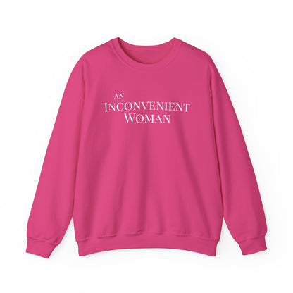 Hot pink sweatshirt with white text "An Inconvenient Woman"