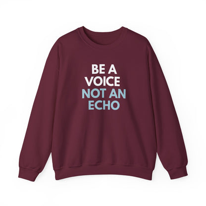 Maroon unisex crewneck sweatshirt with 'Be a Voice Not an Echo' white and blue text