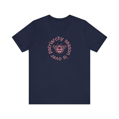 Navy blue unisex t-shirt with 'Patriarchy season is over' dark pink text and bee graphic