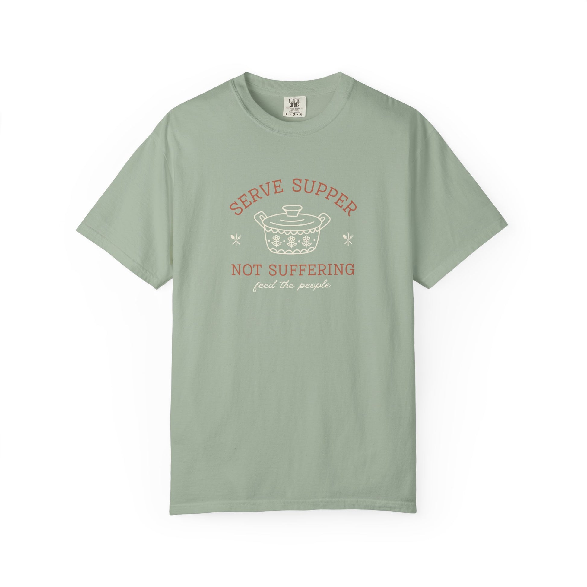 Light green t-shirt with vintage pyrex illustrated graphic and dark orange and white text "serve supper not suffering; feed the people"