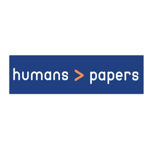 Royal blue bumper sticker with white 'humans > papers' text 