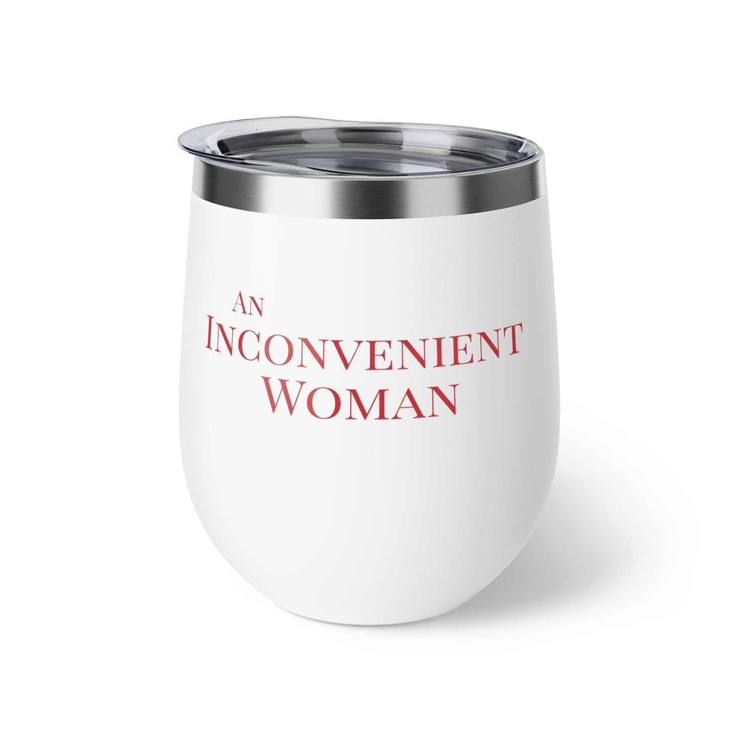 White tumbler with red text "An Inconvenient Woman"