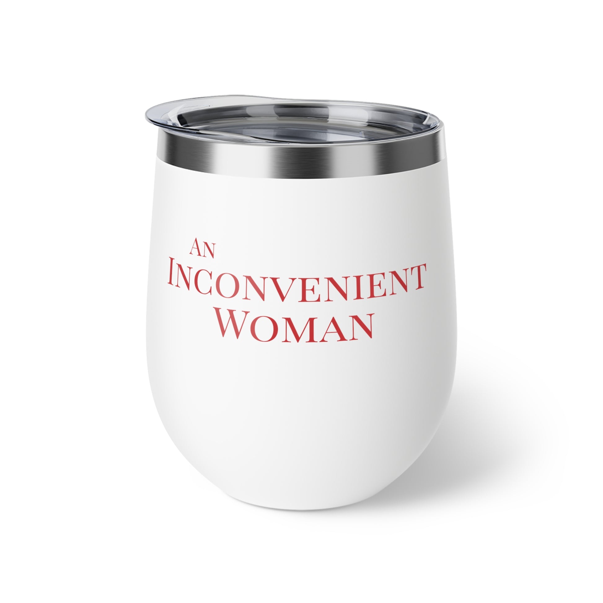 White tumbler with red text "An Inconvenient Woman"