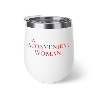 White tumbler with red text "An Inconvenient Woman"