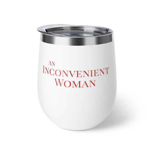 White tumbler with red text "An Inconvenient Woman"