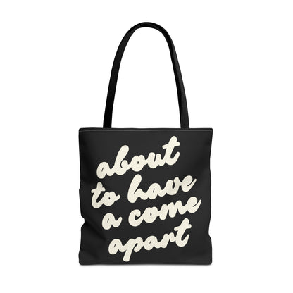 Black tote bag with "about to have a come apart" in cream text