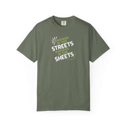 Green t-shirt with white and lime green text "anxious in the streets furious in the sheets (of the constitution)"