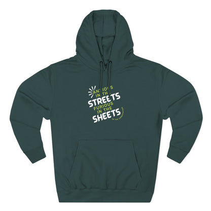 Teal green hoodie with "anxious in the streets furious in the sheets of the constitution" green and white text