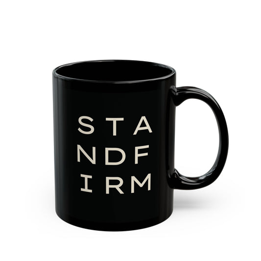 Black ceramic 11 oz coffee or tea mug with 'STAND FIRM' cream text 