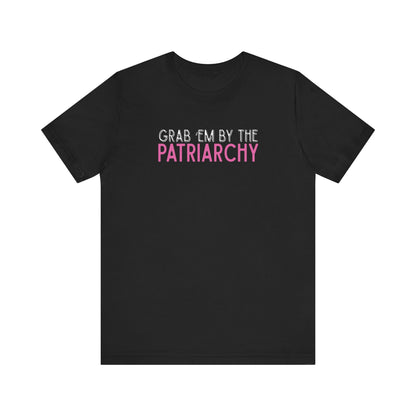 Black t-shirt with black and hot pink text 'Grab em by the Patriarchy' 