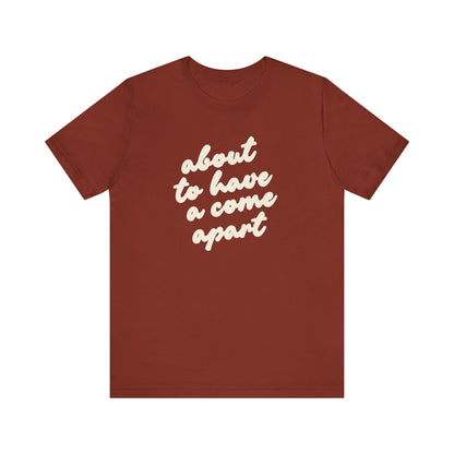 Rust t-shirt with cream words "about to have a come apart"