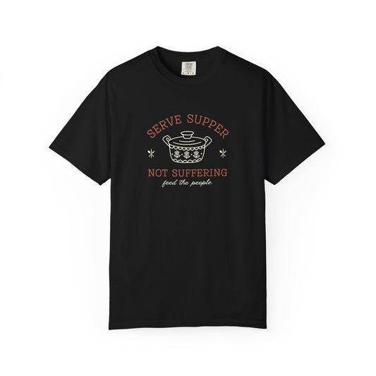 Black t-shirt with vintage pyrex illustrated graphic and dark orange and white text "serve supper not suffering; feed the people"