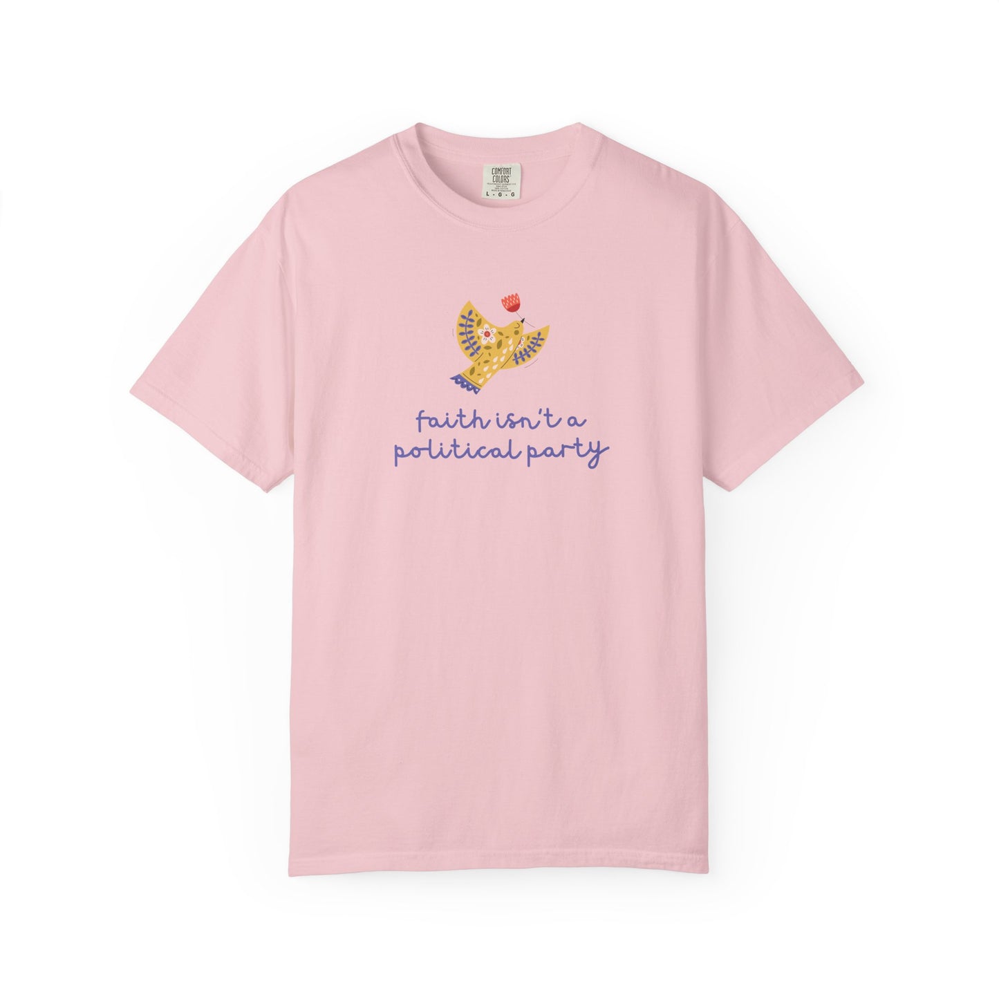 Light pink t-shirt with a folk art dove graphic and purple text "faith isn't a political party"