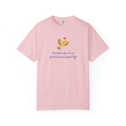 Light pink t-shirt with a folk art dove graphic and purple text "faith isn't a political party"
