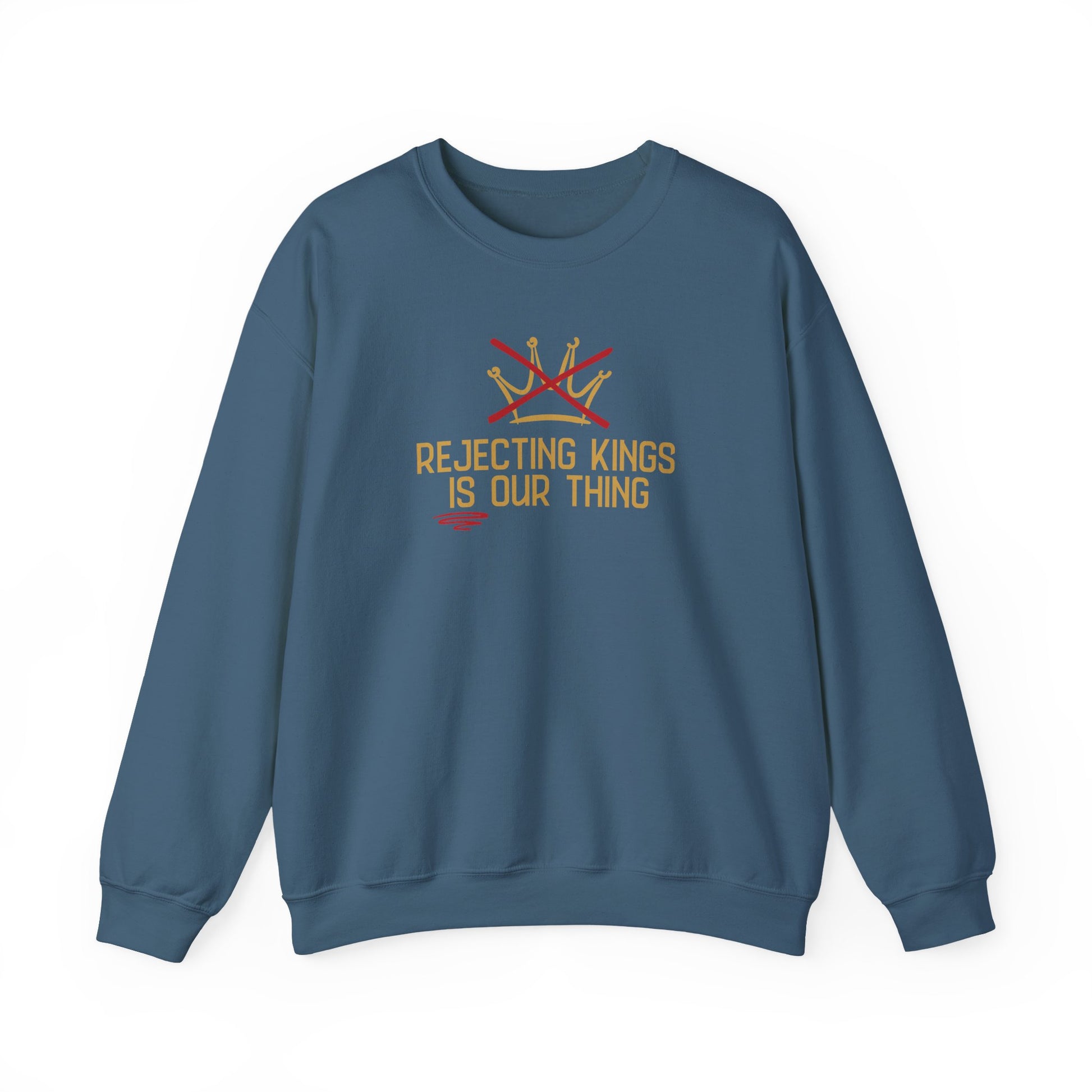 Indigo blue sweatshirt with gold sketch graphic of a crown with a red X over it and gold text "REJECTING KINGS IS OUR THING"