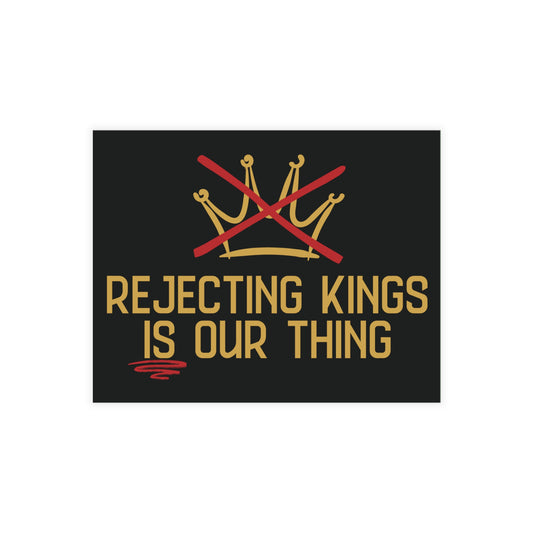 Black postcard with gold sketch graphic of a crown with a red X over it and gold text 'Rejecting Kings is Our Thing' ]